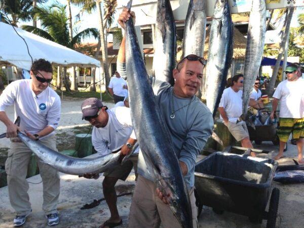 men carrying big fish 2